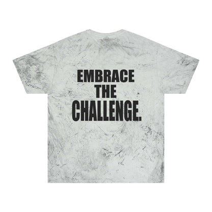 A gray tie-dye t-shirt with a textured pattern reminiscent of a medieval shirt, featuring a motivational message in bold black letters that reads "Embrace the Challenge" on the back.